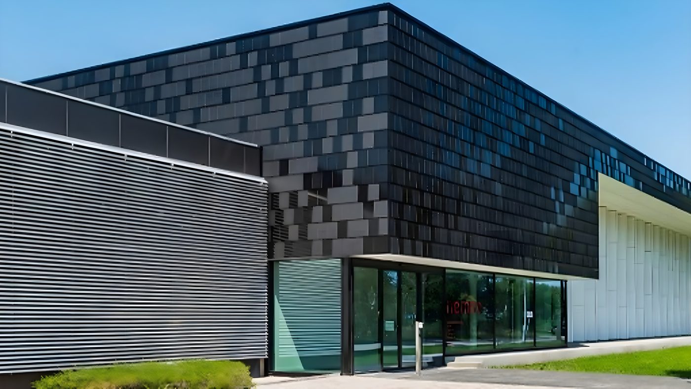 Textured tile-effect façade cladding to a commercial entrance